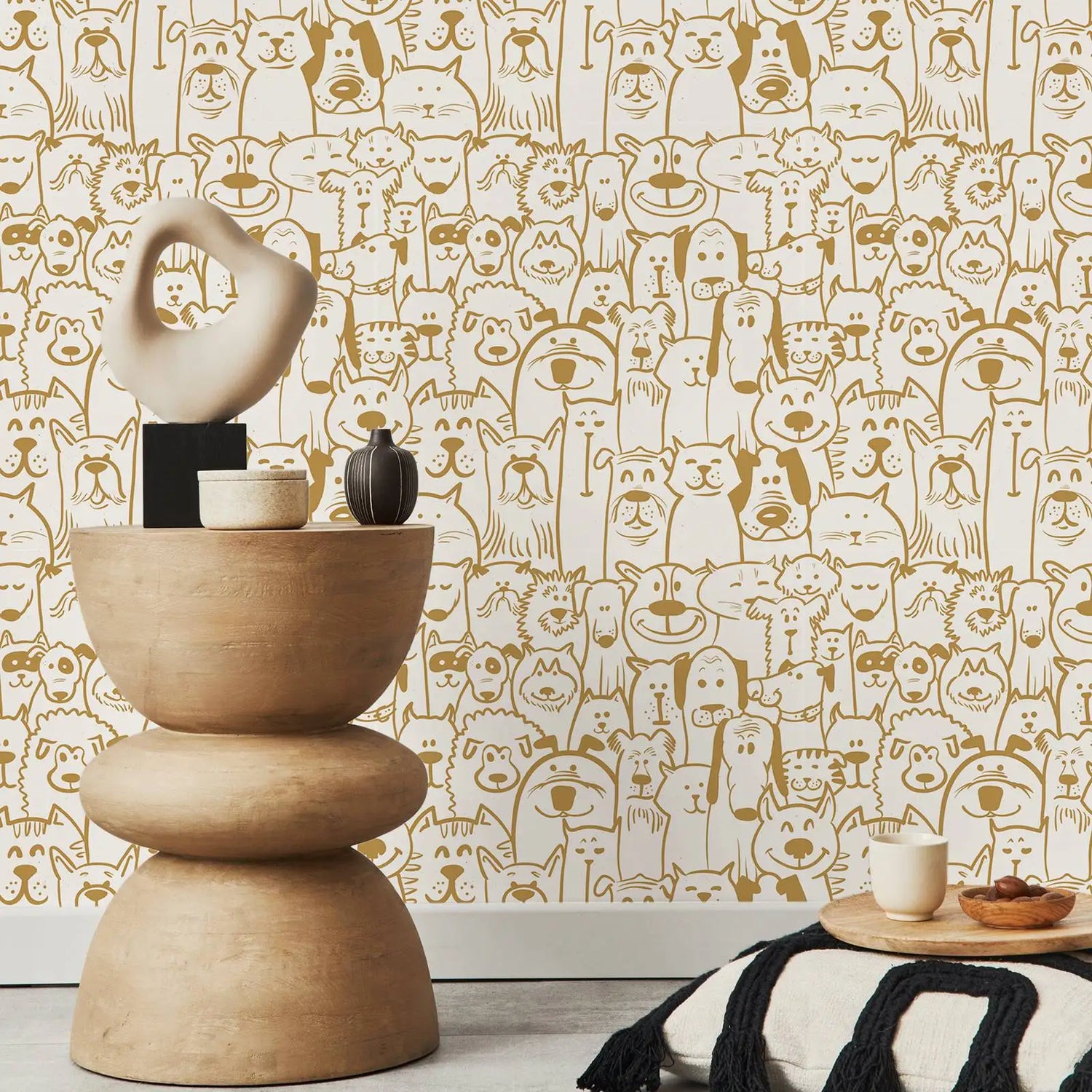 Decorative table with sculptures against a wallpaper with animal patterns