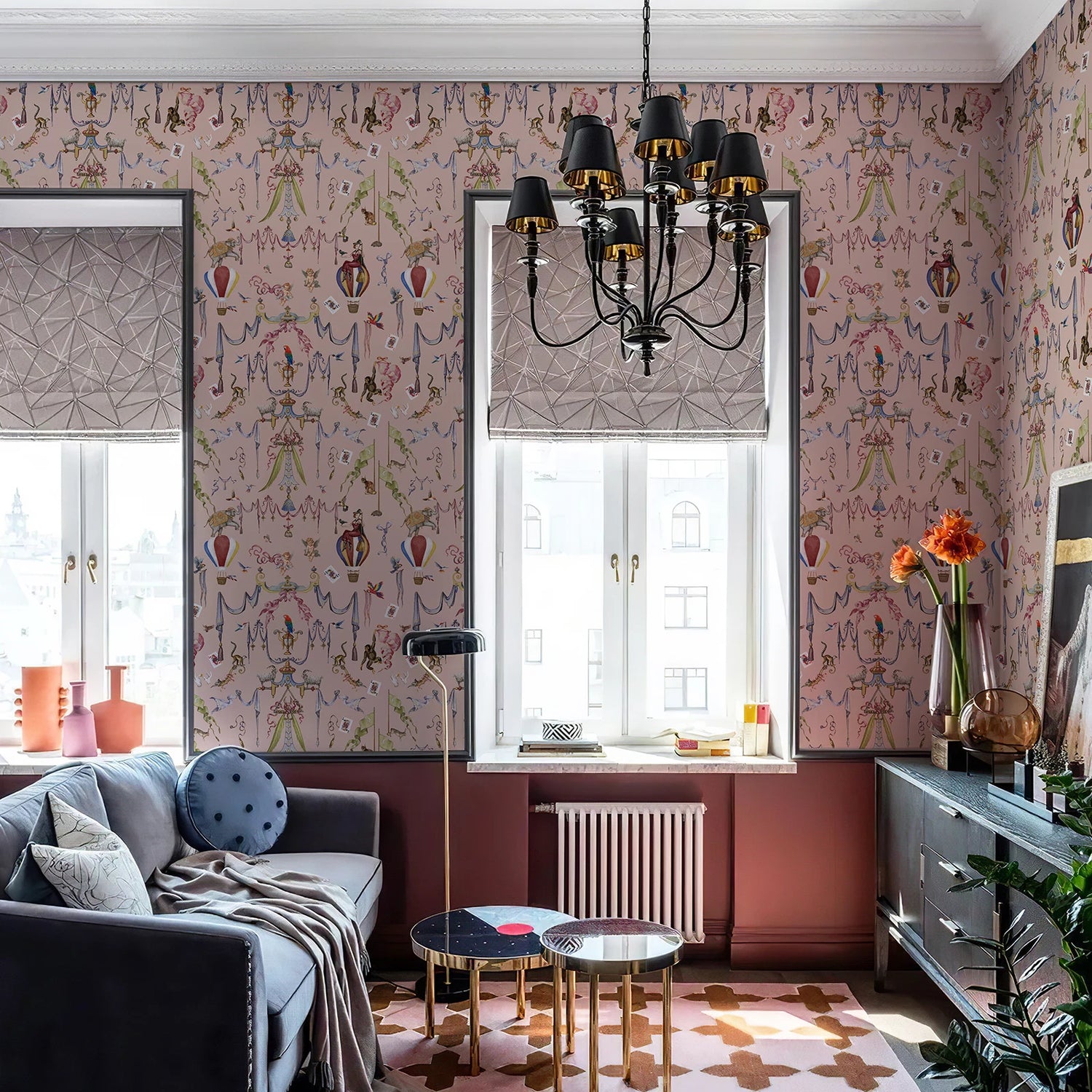 Living room with patterned wallpaper, chandelier, and decorative elements.