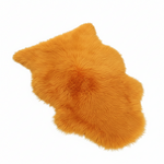 Orange fluffy rug on a white background