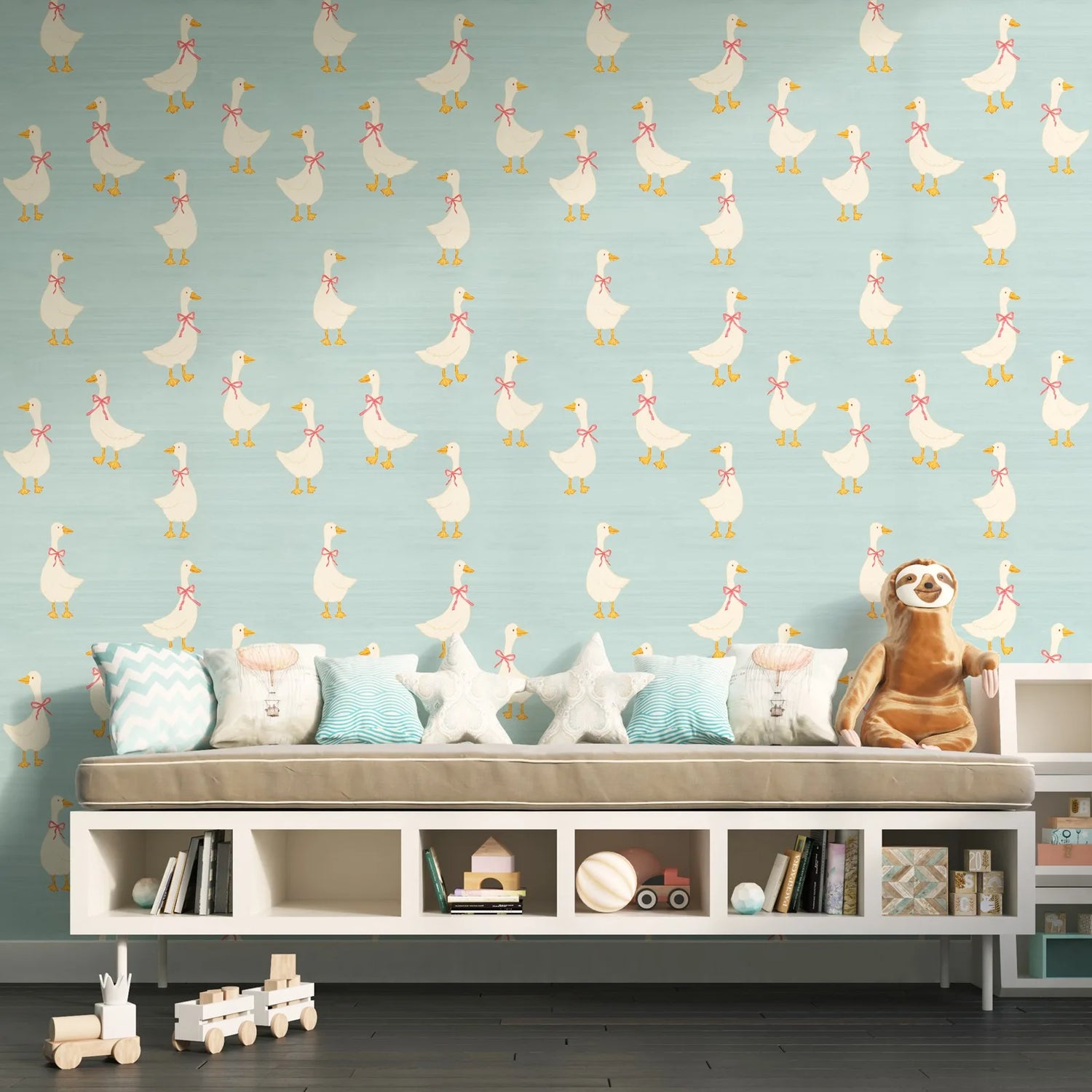 Children's room with a patterned wall, sofa, and toys.