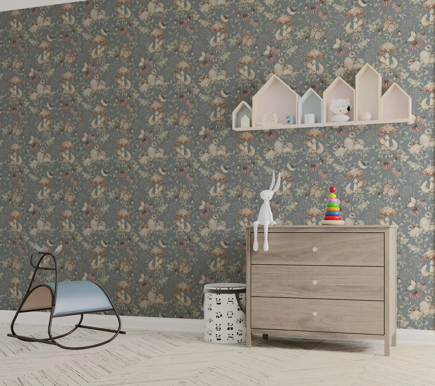 Children's room with floral wallpaper, wooden dresser, and toys.