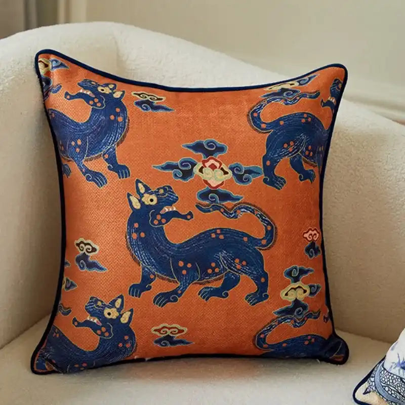 Vintage throw pillow featuring a dragon brocade design in vibrant orange and blue colors, perfect for home decor