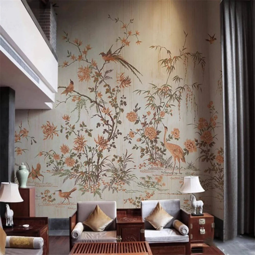 Living room with decorative wall mural featuring floral and bird designs.