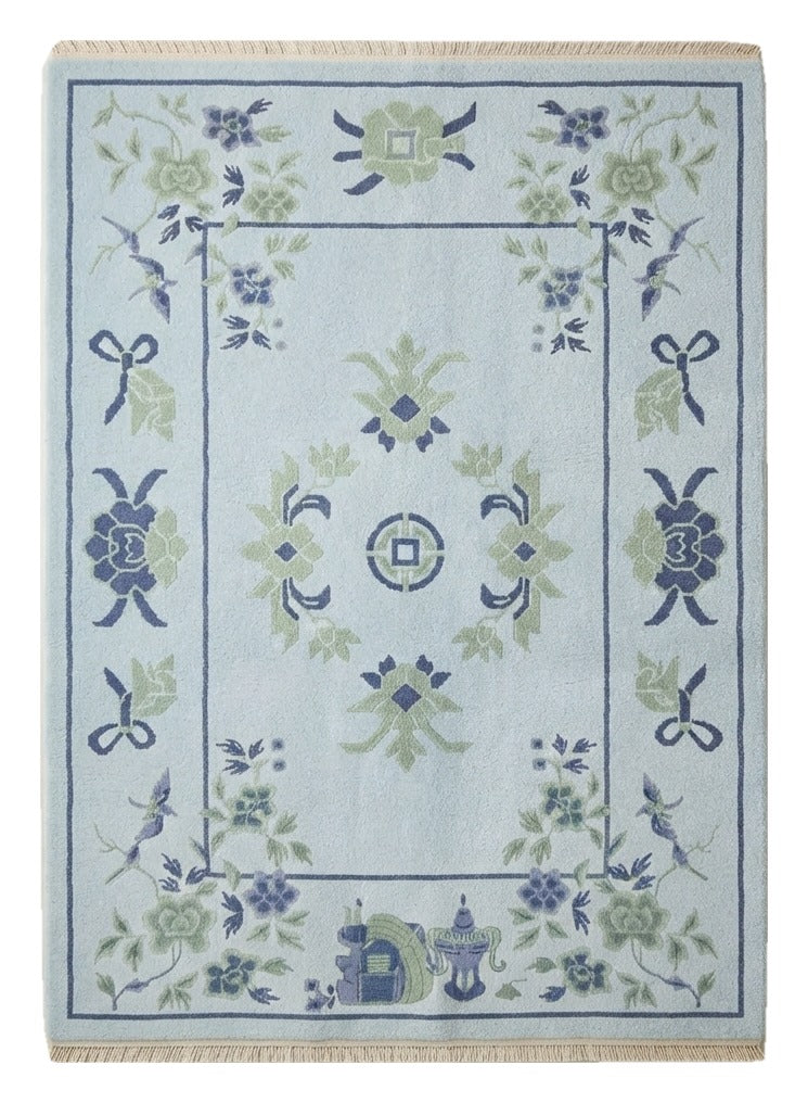 Sky Pavilion Blossom Hand Knotted Rug — light blue, navy, green chinoiserie rug by Maia Homes on a white background