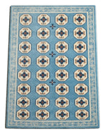 Sky Tile Parade Hand Tufted Wool Rug — light blue, cream, navy geometric rug by Maia Homes on a white background