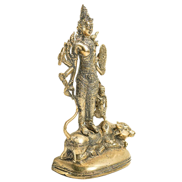 An antique-style brass statue of a Hindu goddess standing on a lion, isolated on a white background.