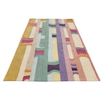 Multicolored geometric patterned rug on a white background
