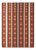 Terracotta Chevron Stripe Flatweave Rug — terracotta, cream, black striped rug by Maia Homes on a white background