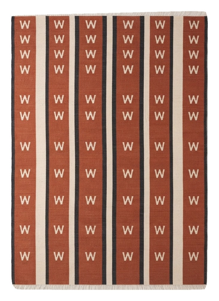 Terracotta Chevron Stripe Flatweave Rug — terracotta, cream, black striped rug by Maia Homes on a white background