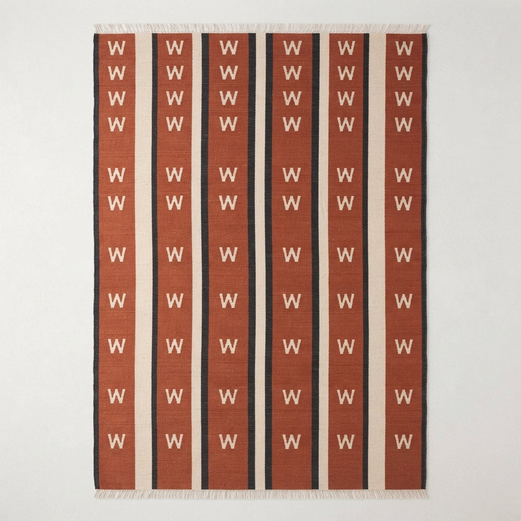 Terracotta Chevron Stripe Flatweave Rug — terracotta, cream, black striped rug by Maia Homes