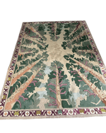 Decorative rug with tree design on a green background