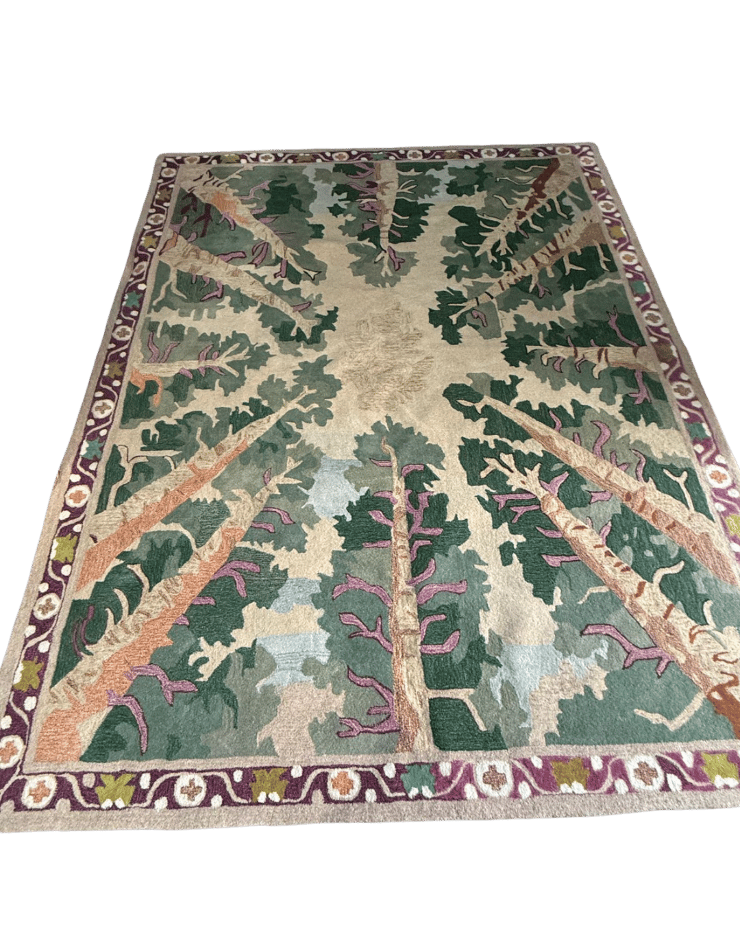 Decorative rug with tree design on a green background