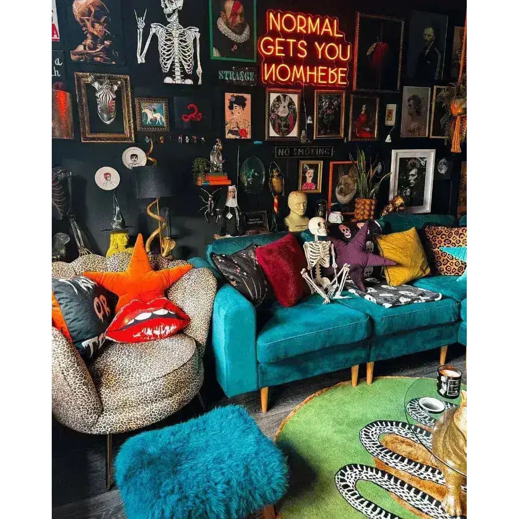 A stylish living room featuring a round wool rug with a scalloped green snake and apple design, adding a unique touch to the space. The area rug complements the vibrant teal sofa and eclectic wall art, making it perfect for large living rooms. This wool rug is an ideal choice for anyone looking to enhance their living room with a bold statement piece.