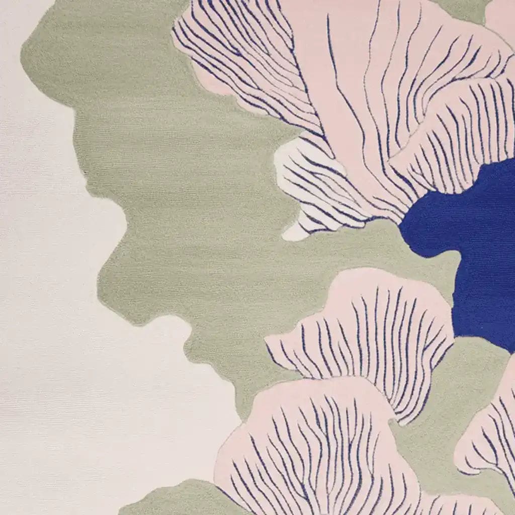 A close-up view of the Abstract Costal Bloom Hand Tufted Rug showcasing its contemporary design. This area rug features a blend of soft pink, green, and blue hues, crafted from high-quality wool. Ideal for living rooms, this 8x10 rug adds a modern touch to any space.