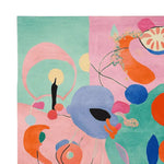 This vibrant area rug features a contemporary abstract design with bold colors like pink, orange, and blue, perfect for adding a pop of color to your living room. The hand-tufted wool rug offers a modern touch and is ideal for living room rugs in an 8x10 size.