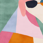 Vibrant abstract design on a square area rug featuring bold colors including green, pink, blue, and orange. This contemporary wool rug adds a lively touch to any living room space, showcasing a playful and artistic pattern.