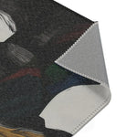 Corner detail of Abstract Duality Flowing Contrast Rug showing grey anti-slip backing with overlock stitching edge and dark art print surface