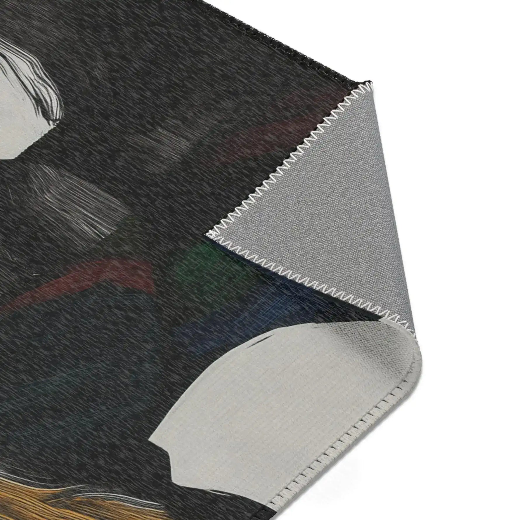 Corner detail of Abstract Duality Flowing Contrast Rug showing grey anti-slip backing with overlock stitching edge and dark art print surface