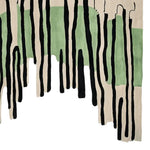 This captivating Abstract Earth Pulse Hand Tufted Area Rug showcases a modern design with flowing black lines and soothing green patches on a neutral background. Perfect for adding a contemporary touch to living rooms, this wool rug offers both style and comfort, making it an ideal choice for those seeking unique living room area rugs.