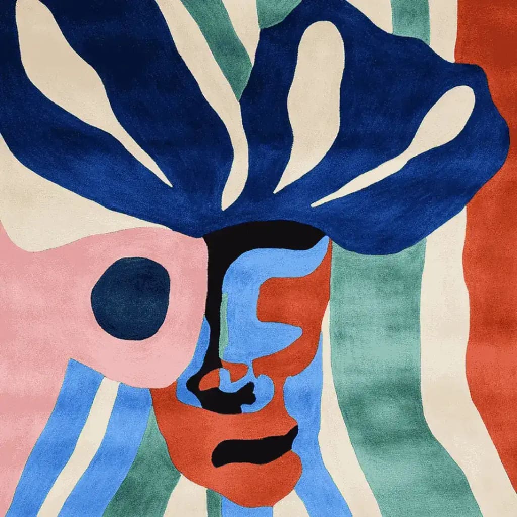 Vibrant abstract face design on a hand-tufted wool area rug. Perfect for adding a contemporary flair to living room spaces, this square rug combines bold colors like blue, pink, and red for a striking visual appeal.