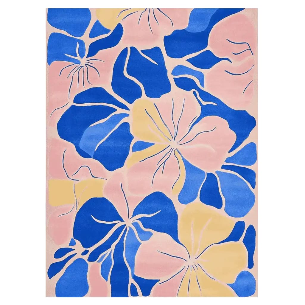 Abstract Floral Bloom Hand Tufted Area Rug featuring vibrant blue and yellow flower patterns on a soft pink background, adding a lively and artistic touch to any room.