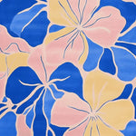 Vibrant abstract floral bloom design on a hand-tufted area rug, featuring bold blue, pink, and yellow hues. Perfect for adding a splash of color to any room.