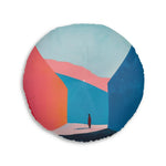 Round floor pillow with coral orange and navy blue geometric color block design showing swirling abstract sections