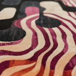 Close-up of a colorful wavy patterned tufted wool rug