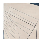 Close-up view of an Abstract Line Field Hand Tufted Area Rug, showcasing its contemporary design with sleek black lines on a soft cream background. Ideal for adding a modern touch to large living rooms, this wool rug combines style and comfort for any contemporary space.