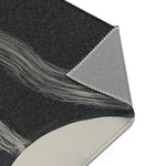 Abstract Noir Striped Elegance Rug backing detail — corner folded open showing grey overlock-stitched underside and cream face layer