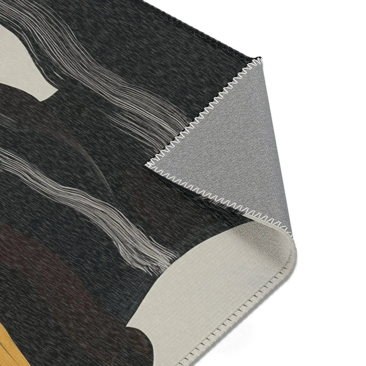 Abstract Noir Striped Elegance Rug corner fold — charcoal pile with white wave stripes folded back showing grey overlock-stitched backing