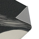 Abstract Noir Striped Elegance Rug wave stripe corner — charcoal pile with sweeping white horizontal lines near edge, backing fold shown