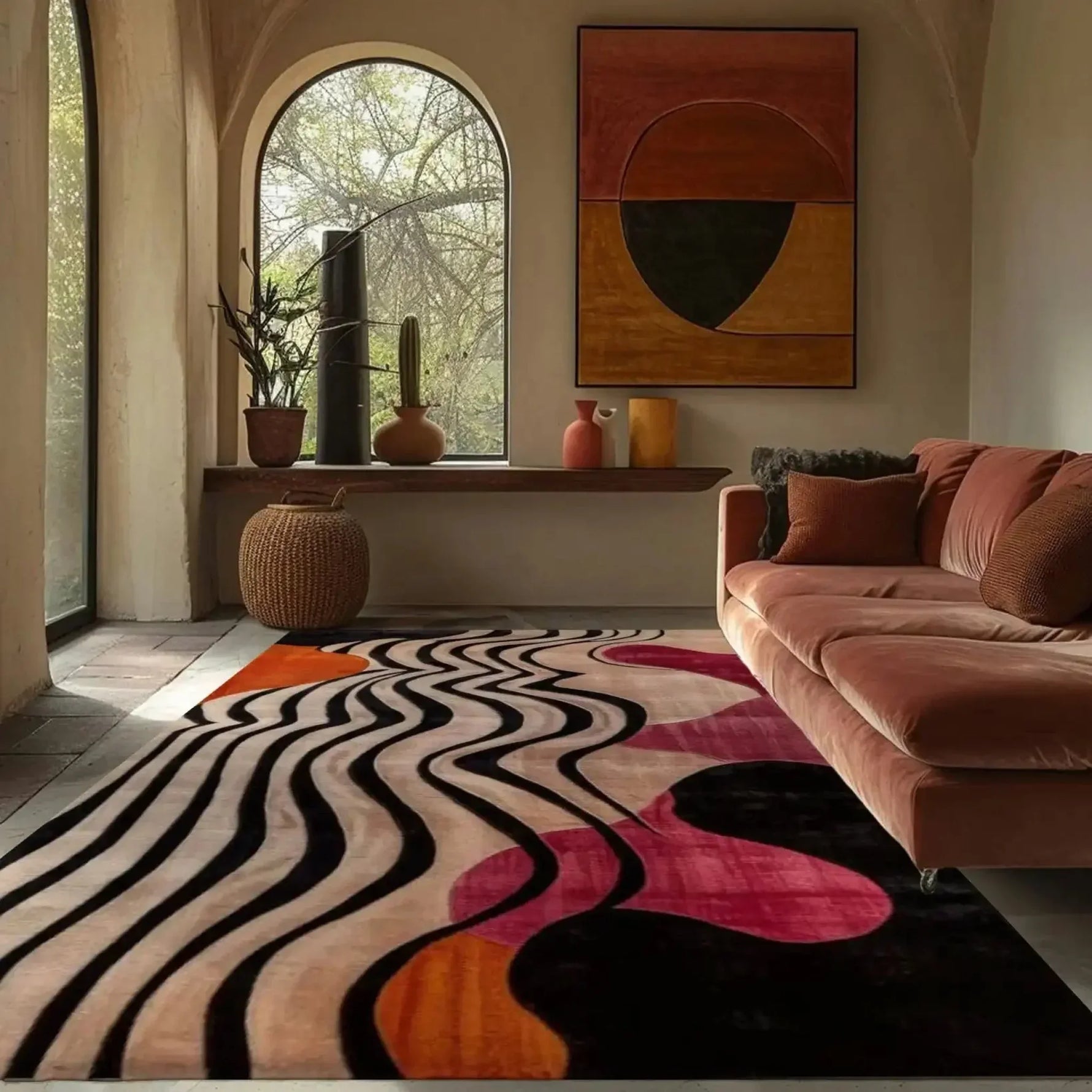abstract odyssey hand tufted viscose rug in a warm arched-window room with blush sofa, wicker stool and earthy art