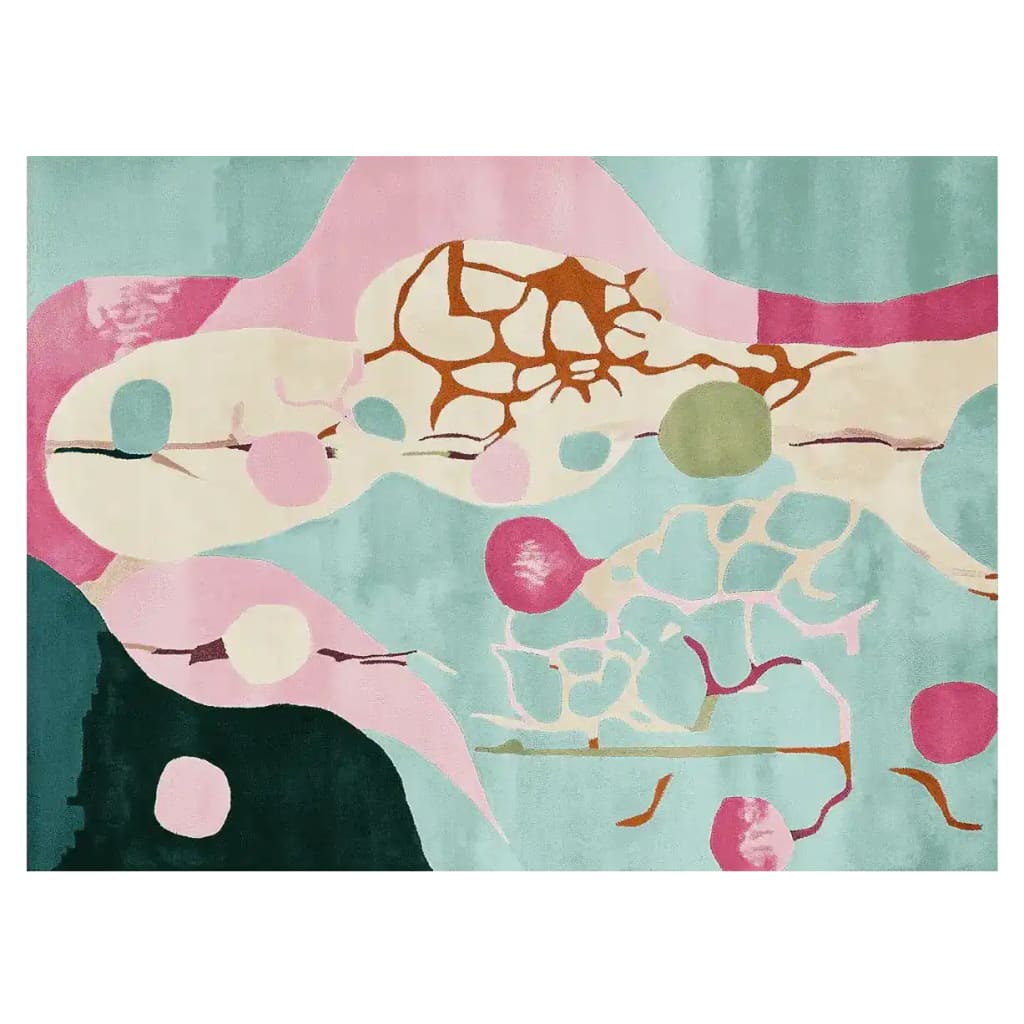 A vibrant area rug featuring an abstract design with bold pink, teal, and cream colors. This contemporary rug showcases organic shapes and patterns, perfect for adding a modern touch to any living room. Hand tufted from wool, this area rug combines artistry and comfort effortlessly.