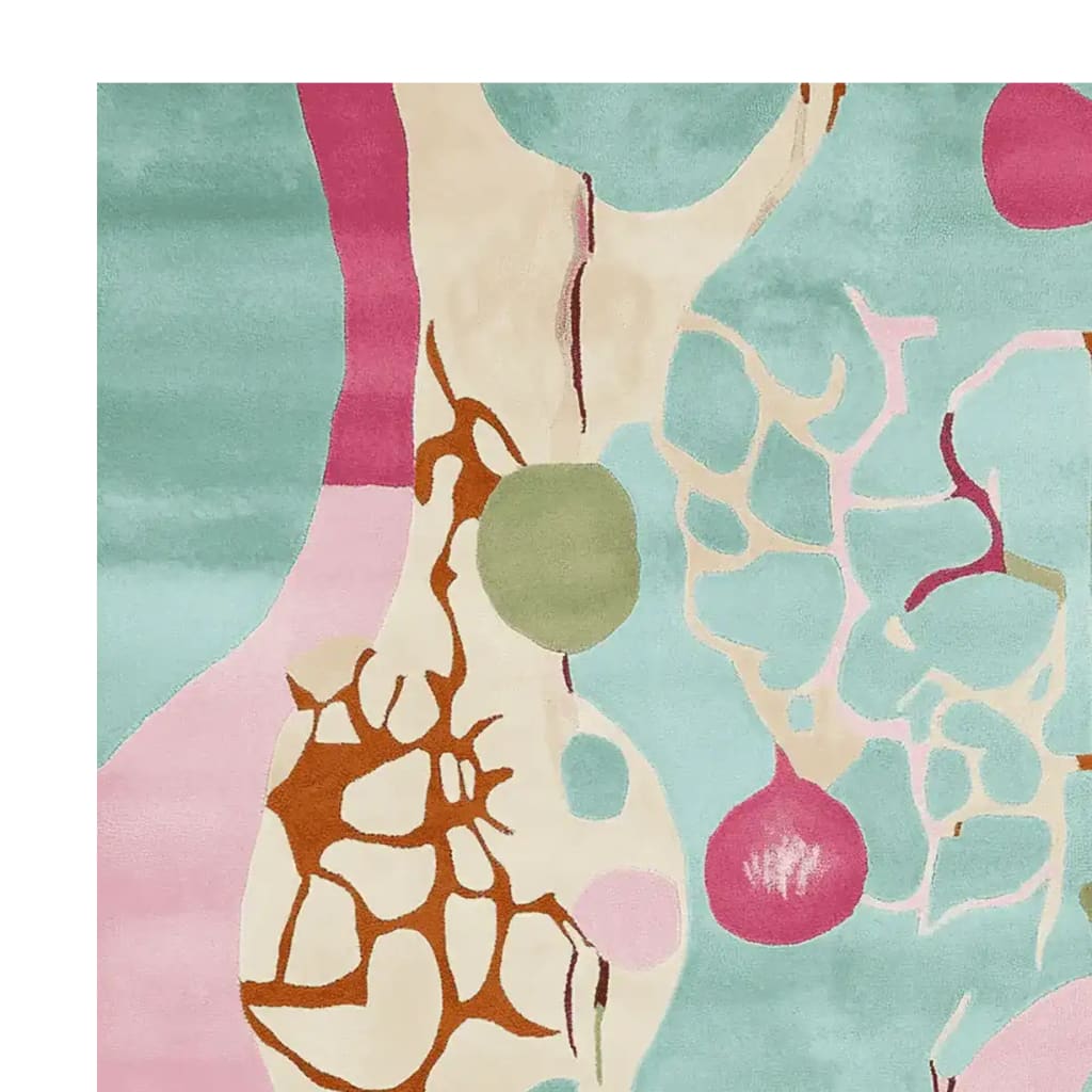 A vibrant area rug with an abstract design featuring bold colors like teal, pink, and brown, perfect for adding a contemporary touch to your living room. This hand-tufted wool rug showcases an artistic pattern with organic shapes, making it a standout piece among area rugs for living room decor.