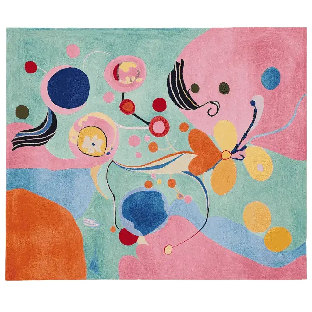 Vibrant abstract shape mirage hand-tufted area rug featuring a playful mix of bold colors and organic patterns. Ideal for enhancing contemporary living room spaces, this large wool rug combines hues of pink, blue, orange, and green, making it a standout piece among living room area rugs.