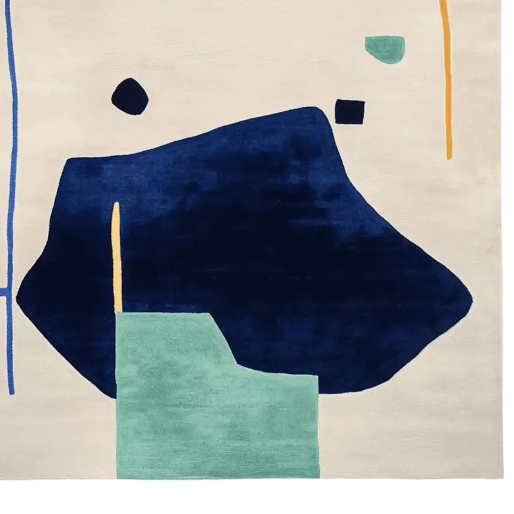 Top view of an Abstract Story Hand Tufted Area Rug, perfect for large living room spaces. This contemporary wool rug features bold geometric shapes in navy, teal, and mustard on a neutral background, ideal for adding a modern touch to your living room decor.