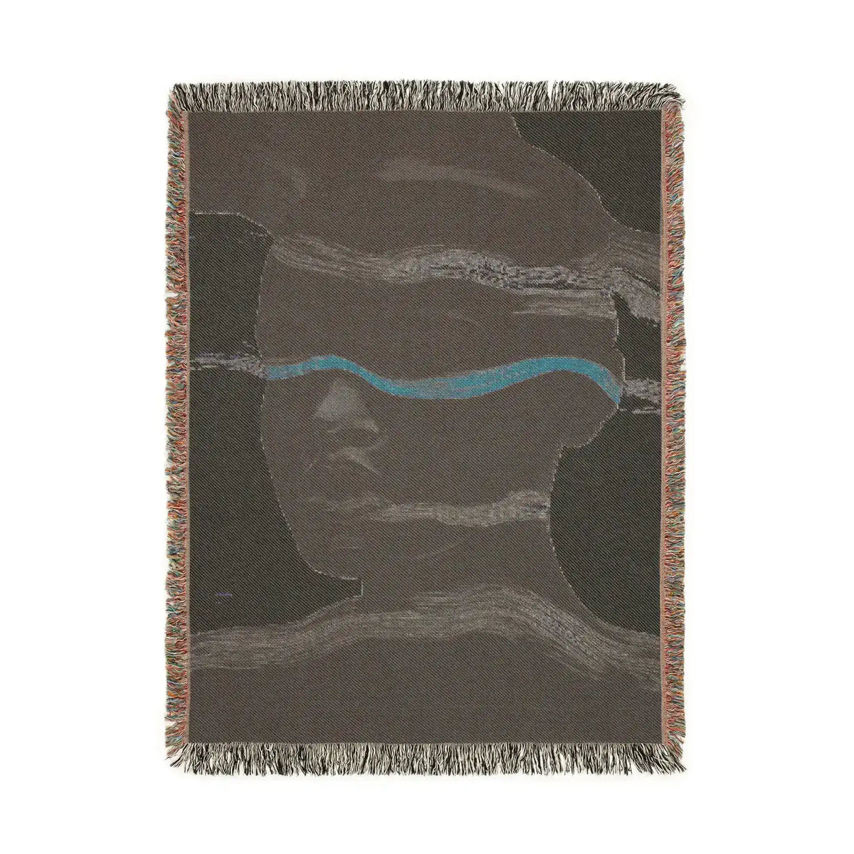 Portrait view of reverse side of abstract woven blanket in dark taupe with teal accent stripe and subtle face, fringe edges