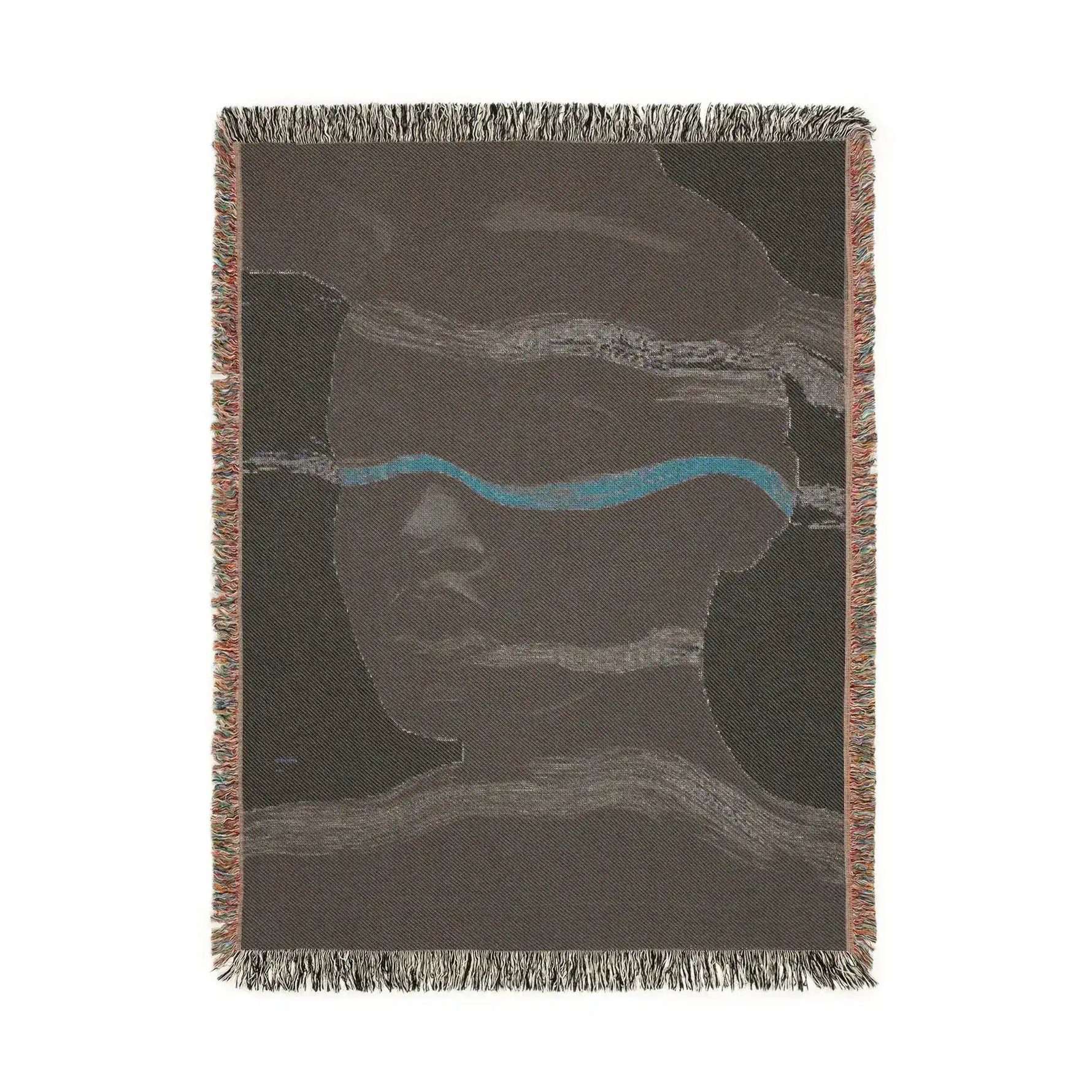 Portrait view of reverse side of abstract woven blanket in dark taupe with teal accent stripe and subtle face, fringe edges