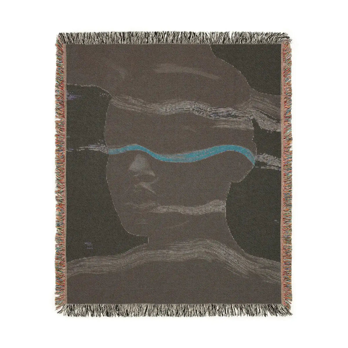 Square-cropped back side of abstract woven blanket in dark taupe with lavender-teal stripe and face outline, fringe border