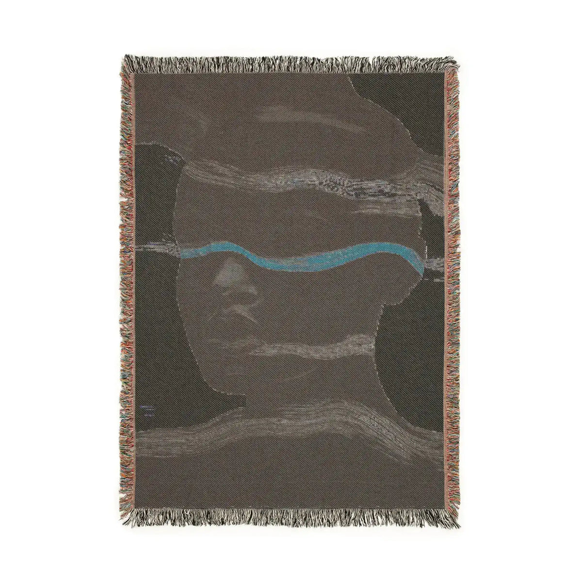 Reverse side of woven blanket with dark brown cotton ground, teal horizontal stripe and abstract face in subtle tones, fringe edges