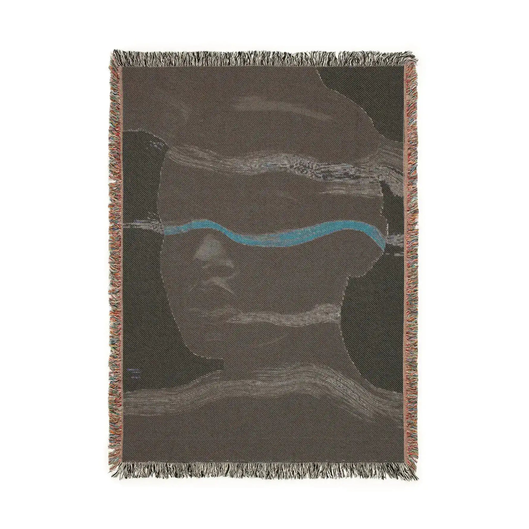 Reverse side of woven blanket with dark brown cotton ground, teal horizontal stripe and abstract face in subtle tones, fringe edges