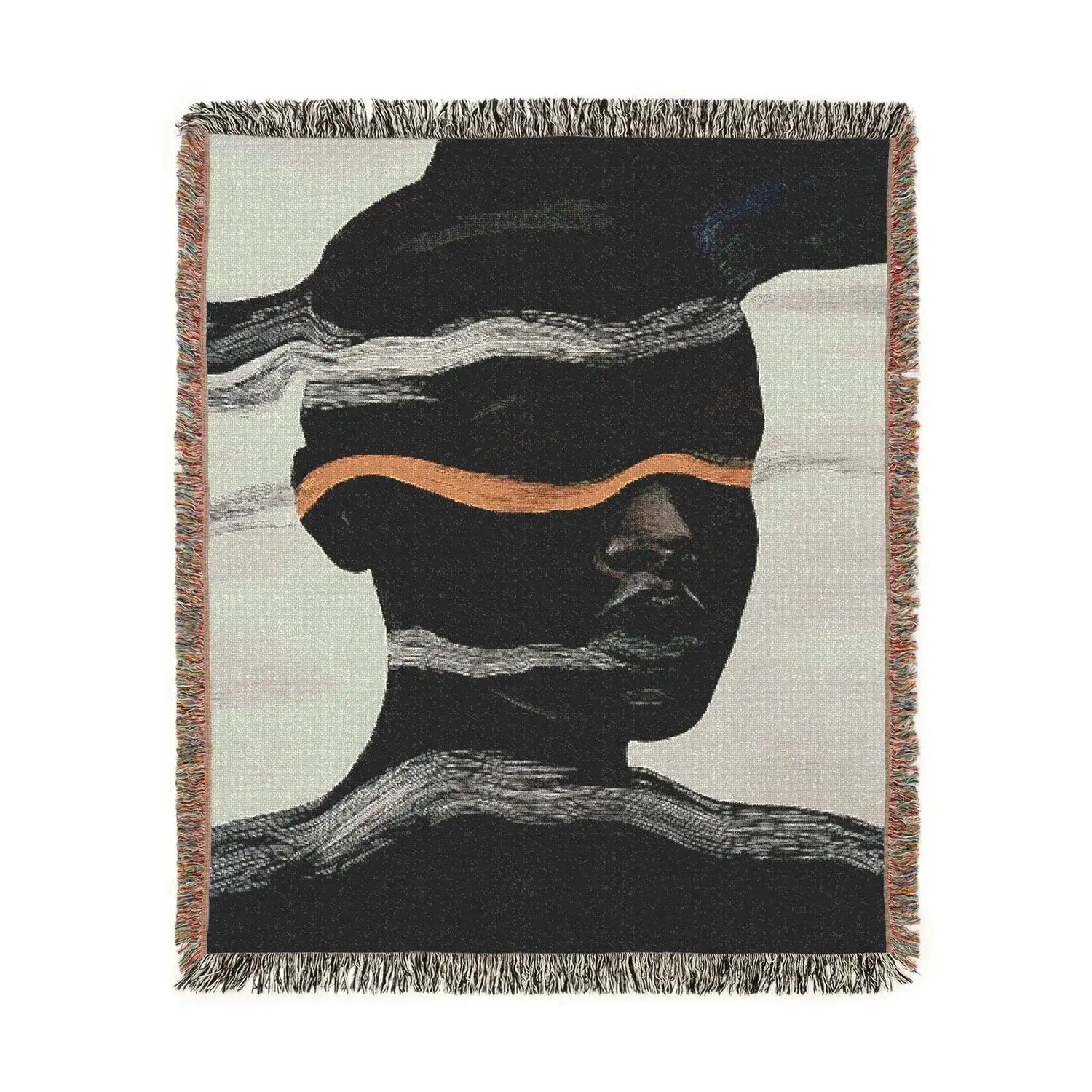 Square-cropped woven throw blanket with dark abstract face silhouette, white wave bands and copper-gold horizontal stripe, fringe edges