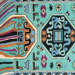 Top view of the Alaia Persian Turquoise Melting Area Rug showcasing intricate patterns and vibrant colors, perfect for large area rugs in living rooms or offices. This wool rug features an abstract design with rich teal, blue, and earthy tones.