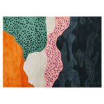A vibrant hand tufted wool area rug featuring an abstract design with bold colors, including orange, green, pink, and black patterns, creating a dynamic and modern aesthetic.