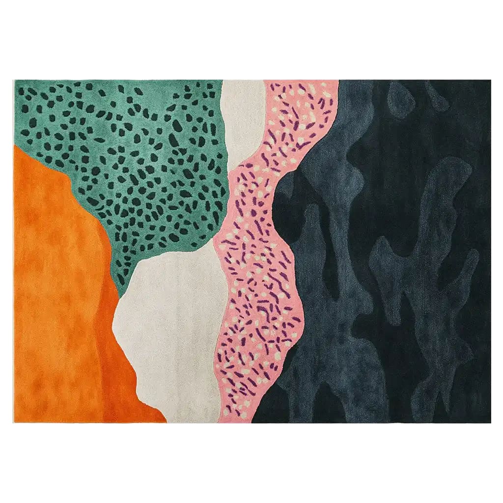 A vibrant hand tufted wool area rug featuring an abstract design with bold colors, including orange, green, pink, and black patterns, creating a dynamic and modern aesthetic.