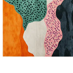 Vibrant area rug featuring an abstract design with bold colors including orange, green, pink, and black. The hand-tufted wool rug showcases unique patterns resembling organic shapes, adding a modern artistic touch to any room.