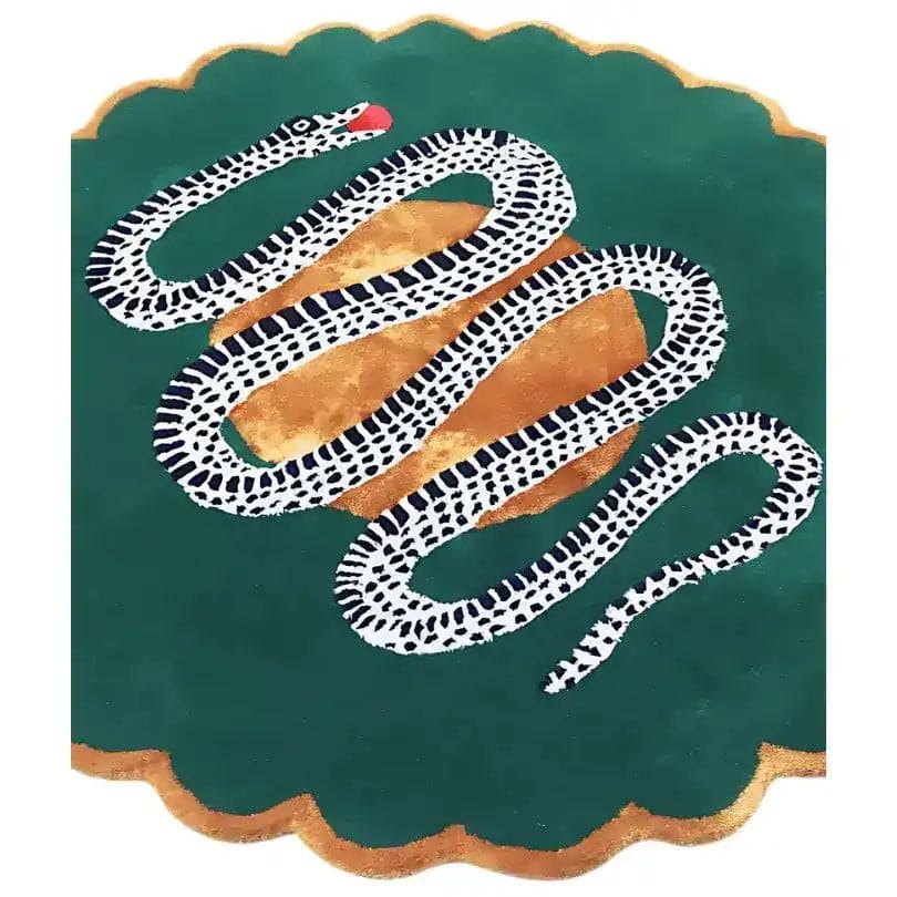 Angled view of green scalloped snake rug, dotted white-and-black serpent coiling across gold fruit