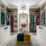 Luxurious walk-in closet with an animal pattern rug, colorful decor and a large mirror.