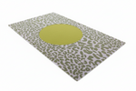 Rug with a green circular design on a white background
